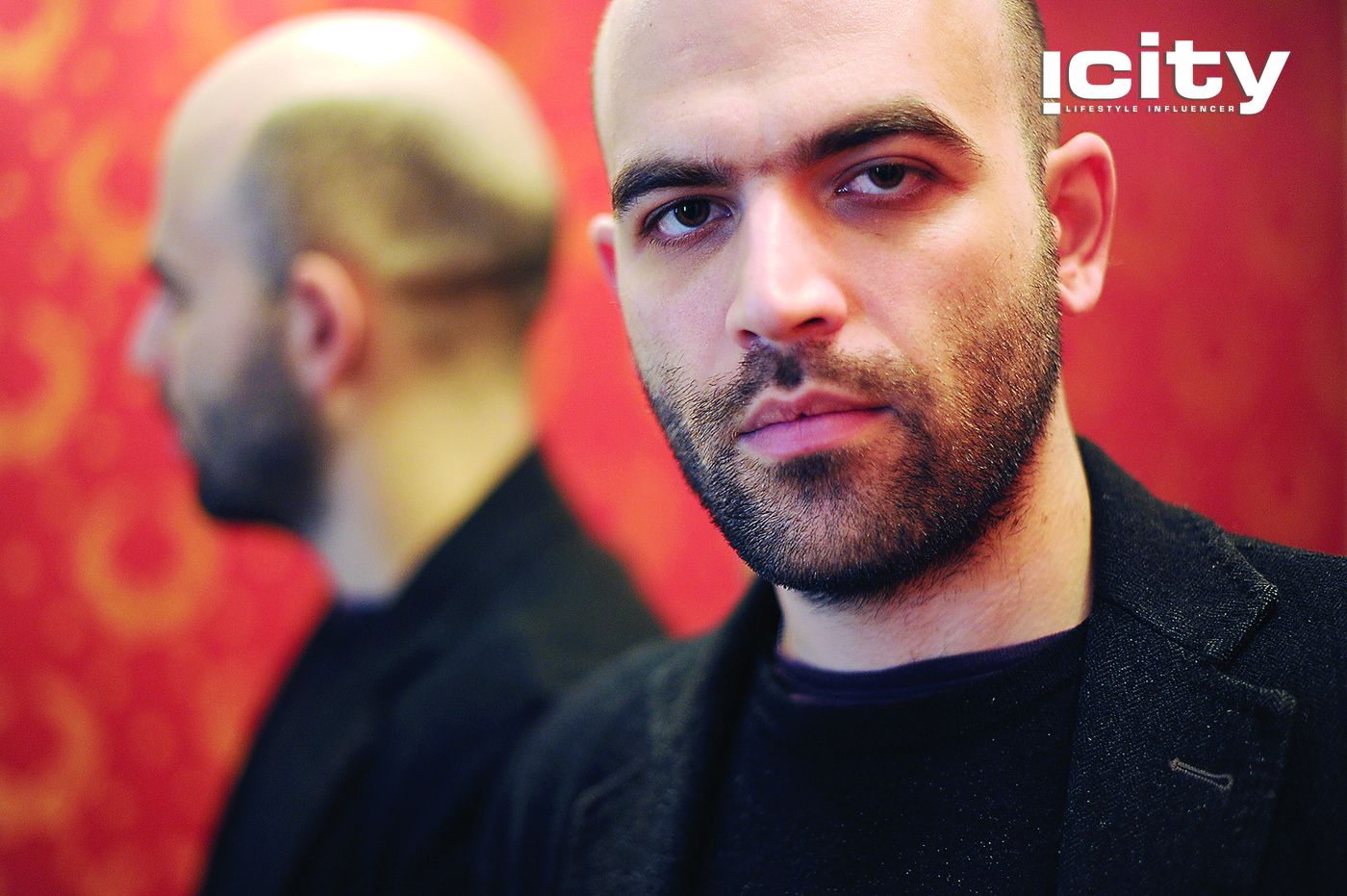 Italian writer Roberto Saviano gives an interview on March 17, 2010 in Rome. Saviano, 29, whose book "Gomorrah" has been translated into 42 languages, has lived under police protection for two years. The screen version of "Gomorrah," directed by Matteo Garrone, won second prize at the 2008 Cannes film festival and was in the running for an Oscar. His book, exposes the workings of the powerful Naples mafia, the Camorra.      AFP PHOTO / CHRISTOPHE SIMON (Photo credit should read CHRISTOPHE SIMON/AFP/Getty Images)